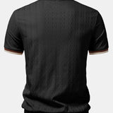 Polo in maglia strutturata con bordi a contrasto e cerniera