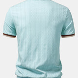 Polo in maglia strutturata con bordi a contrasto e cerniera